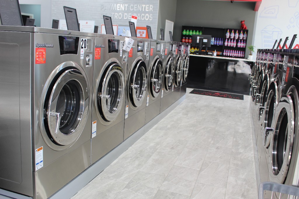 Rows of Speed Queen front-load washers and the payment center
