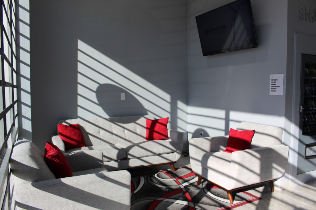 Comfortable lounge with sofas and TV